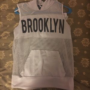 Cropped, sleeveless hoodie.